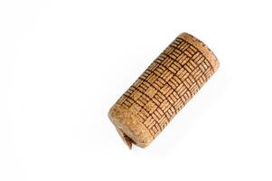 Wine bottle cork Isolated on white background. One Wooden Cork Close up. photo