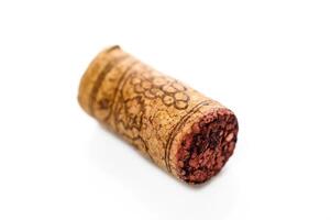 Wine bottle cork Isolated on white background. One Wooden Cork Close up. photo