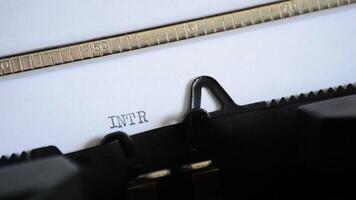 Typing the word INTRODUCTION with in a old manual typewriter video