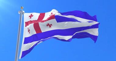 Adjara flag waving at wind in slow with blue sky, loop video