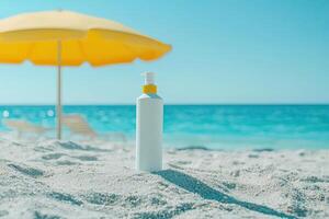 Sunscreen bottle on sandy beach with umbrella and blue sky background. Summer vacation concept photo