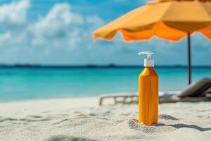 Sunscreen bottle on sandy beach with umbrella and blue sky background. Summer vacation concept photo