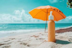Sunscreen bottle on sandy beach with umbrella and blue sky background. Summer vacation concept photo