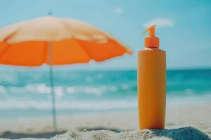 Sunscreen bottle on sandy beach with umbrella and blue sky background. Summer vacation concept photo