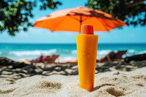 Sunscreen bottle on sandy beach with umbrella and blue sky background. Summer vacation concept photo