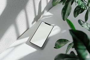 Smartphone with blank screen placed on background surface photo