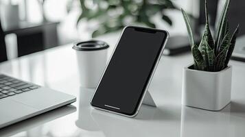 Smartphone with blank screen placed on background surface photo