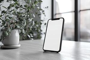 Smartphone with blank screen placed on background surface photo