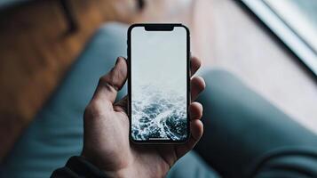 Smartphone with blank screen placed on background surface photo