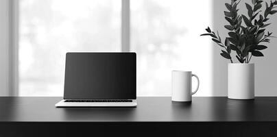 Laptop and coffee cup on black table in office. Workplace concept photo