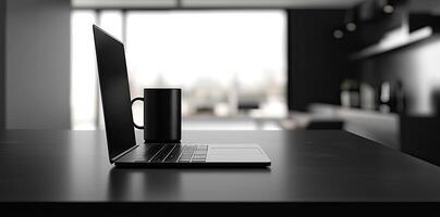 Laptop and coffee cup on black table in office. Workplace concept photo