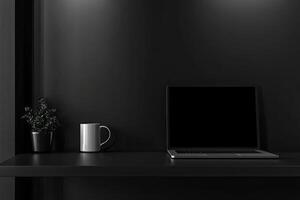 Laptop and coffee cup on black table in office. Workplace concept photo