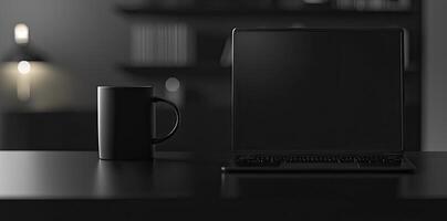 Laptop and coffee cup on black table in office. Workplace concept photo