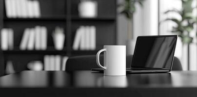Laptop and coffee cup on black table in office. Workplace concept photo