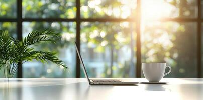Blurred background of a modern home office interior with a laptop computer and a coffee cup on a white table, with copy space for text in the blurred window view. Business work from home concep photo
