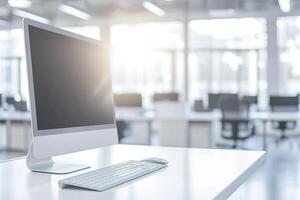 Minimalist white desk with a computer and office background, blurred business center interior in the blurred background. Mockup for design or presentation photo