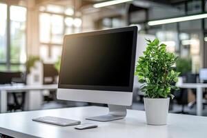 Minimalist white desk with a computer and office background, blurred business center interior in the blurred background. Mockup for design or presentation photo