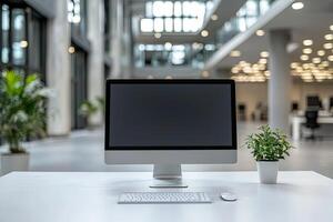 Minimalist white desk with a computer and office background, blurred business center interior in the blurred background. Mockup for design or presentation photo