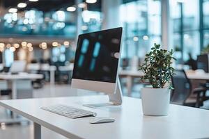Minimalist white desk with a computer and office background, blurred business center interior in the blurred background. Mockup for design or presentation photo