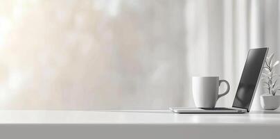 Minimalist white office desk with laptop and coffee mug on a blurred background, with space for text, representing the concept of working from home photo