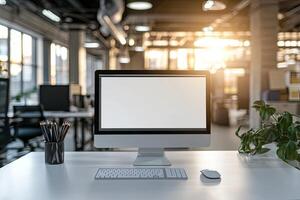 Minimalist white desk with a computer and office background, blurred business center interior in the blurred background. Mockup for design or presentation photo