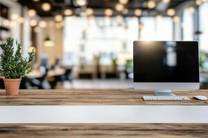 Minimalist white desk with a computer and office background, blurred business center interior in the blurred background. Mockup for design or presentation photo
