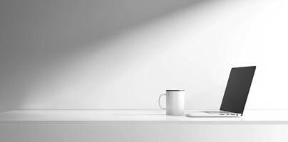 Minimalist white office desk with laptop and coffee mug on a blurred background, with space for text, representing the concept of working from home photo
