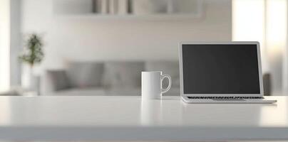 Minimalist white office desk with laptop and coffee mug on a blurred background, with space for text, representing the concept of working from home photo