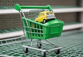 A small toy car is sitting in a shopping cart photo
