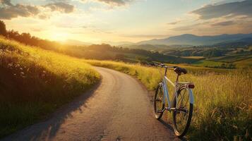 Cyclist riding through scenic countryside path. Scenic cycling route through countryside landscape photo