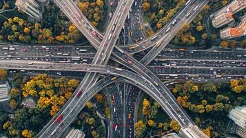 Aerial view of highway road interchange with busy urban traffic speeding on the road photo