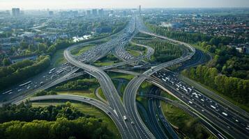 Aerial view of highway road interchange with busy urban traffic speeding on the road photo