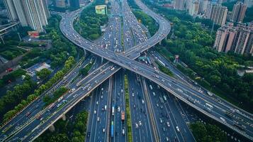 Aerial view of highway road interchange with busy urban traffic speeding on the road photo