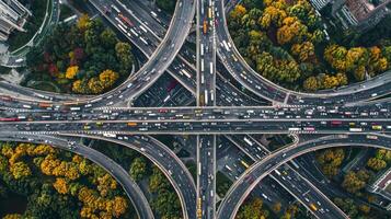 Aerial view of highway road interchange with busy urban traffic speeding on the road photo