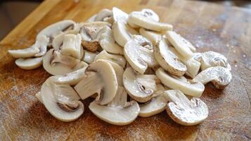 Sliced mushrooms ready for cooking on a cutting board photo