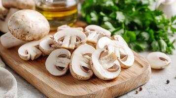 Sliced mushrooms ready for cooking on a cutting board photo