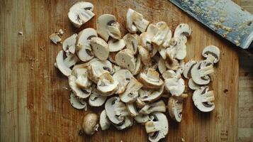 Sliced mushrooms ready for cooking on a cutting board photo