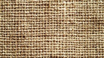 Burlap texture, background of scratchy burlack material in an even light brown color photo