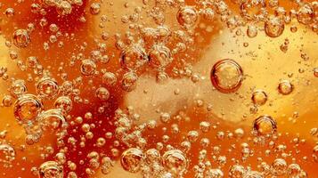 A glass of soda with ice cubes in it. The bubbles in the soda are rising to the top photo