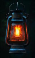 A lantern with a lit candle inside. The lantern is old and rusted, and the flame is yellow. The image has a warm and cozy feeling, as if it were lit in a cabin or a cozy room photo