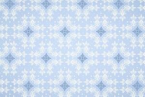 Elegant winter pattern with beautiful snowflakes on a soft blue background. Creative snowy design. vector