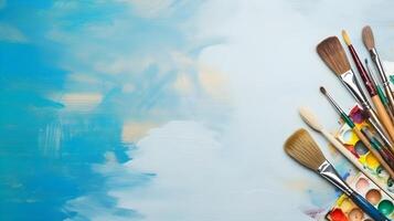 Collection of Painting Tools Including Brushes, Spatula, and Roller photo