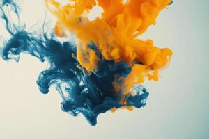 Colorful swirls of orange and blue ink blending in water, creating captivating abstract art photo