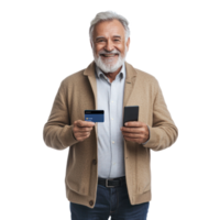 Smiling senior man holding holding a credit card and a mobile phone, standing front view isolate on transparent background png