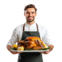 Smiling man holding a tray with roasted turkey for thanksgiving, standing front view isolate on transparent background png