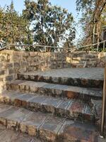 A man on a skateboard riding down a set of stairs photo
