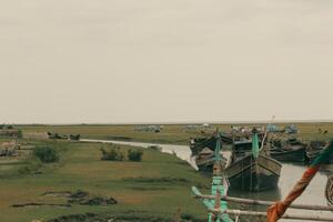Exploring the Natural Beauty of Nijhum Dwip Green Fields, Colorful Boats, and Scenic Rivers photo
