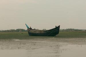 Beautiful Boat Preparing to Launch into the Waters of Nijhum Dwip photo