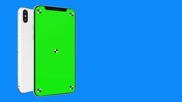 3D render of two smartphone with a blue background. Rotating in screen. With a green screen for easy keying. Easy customisable. video