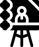 A black and white icon of a person sitting at a desk vector